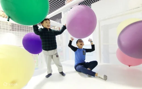Toddler exploring the safe and colorful Honeycomb Kids Zone