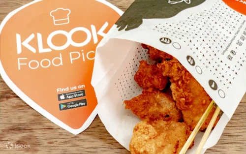 Freshly deep-fried chicken being prepared upon order