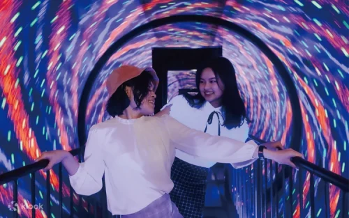 Family having fun in the anti-gravity floating illusion room