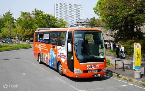 A spectacular view of the majestic Osaka Castle from the comfortable hop-on hop-off bus.