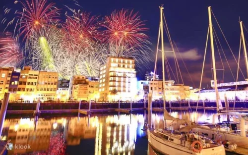 Colorful fireworks illuminating the night sky over the ocean in Penghu