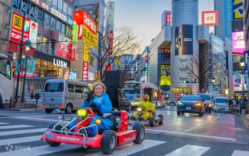Tourists wearing fun cosplay costumes on street go karts