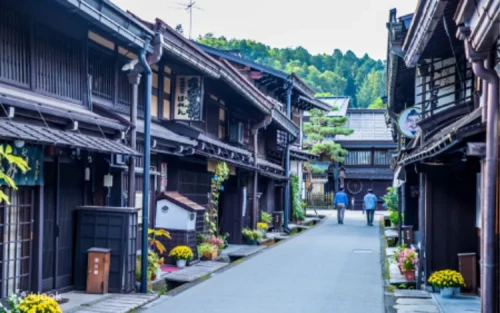 Historic wooden merchant houses lining the beautifully preserved streets of Takayama Old Town