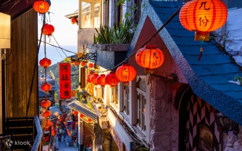 Releasing colorful sky lanterns at Shifen Old Street railway