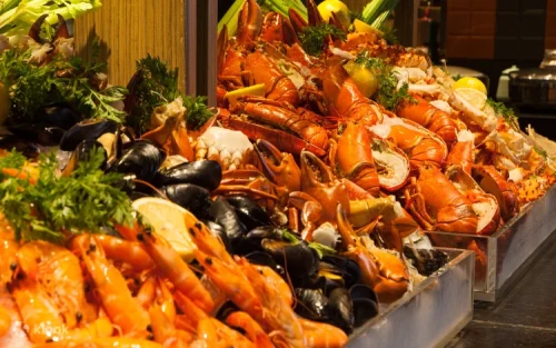 Chefs cooking live at the open kitchen in JEN Singapore Tanglin