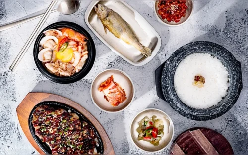 Sizzling Korean barbecue meats served on a hot plate