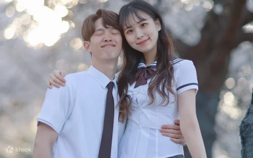 A group of friends taking fun photos in their Korean school uniforms.
