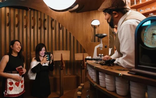 Guests exploring the mind-bending alternate reality set design