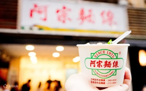 Crowd of locals and tourists eating famous noodles in Ximending