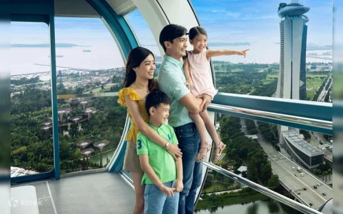 Excited family taking photos during the Marina Bay river cruise