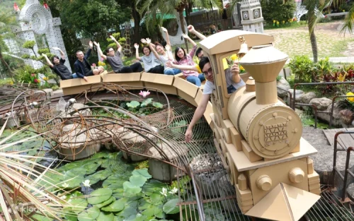 Families enjoying a ride on the famous cardboard Carton Train in Taichung