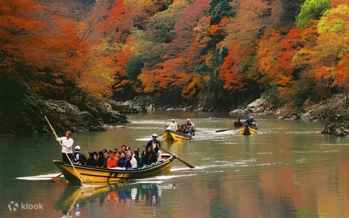 Vibrant autumn foliage reflecting on the crystal clear waters of Hozugawa