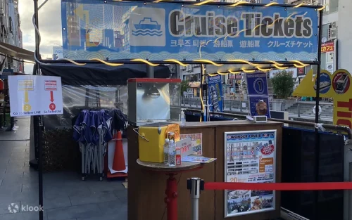 Passengers enjoying refreshing drinks and panoramic skyline views on the boat