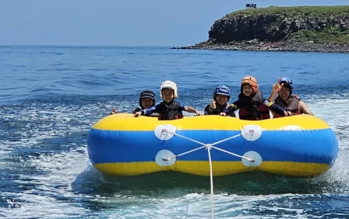 Snorkeling among vibrant marine life in the azure blue Taiwan sea.
