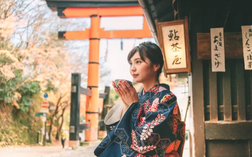 Wide selection of colorful traditional Japanese kimonos and yukatas hanging on racks in the boutique.