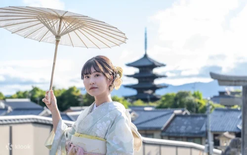 Family dressed in matching traditional Japanese attire smiling together during their Kyoto vacation.