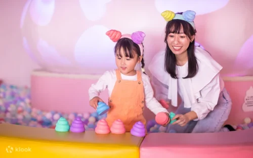 Colorful ball pit filled with plush poop toys at the Unteractive zone