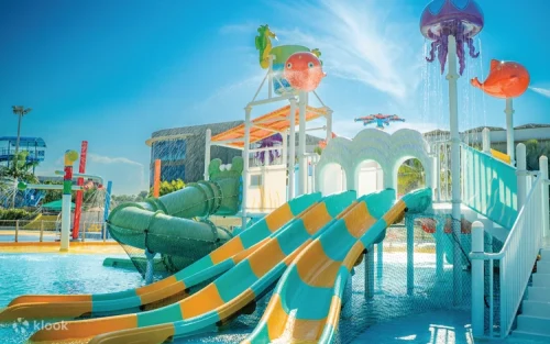 Families enjoying the giant Tsunami wave pool at Wild Wild Wet Singapore