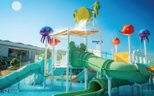 Kids playing at the new Sea-The-World water playground with tipping bucket
