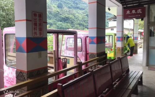 Vintage Wulai trolley traveling through the lush forest