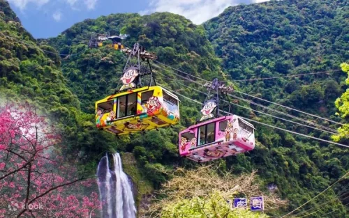 Panoramic view of Wulai Waterfall and lush mountains in Taiwan